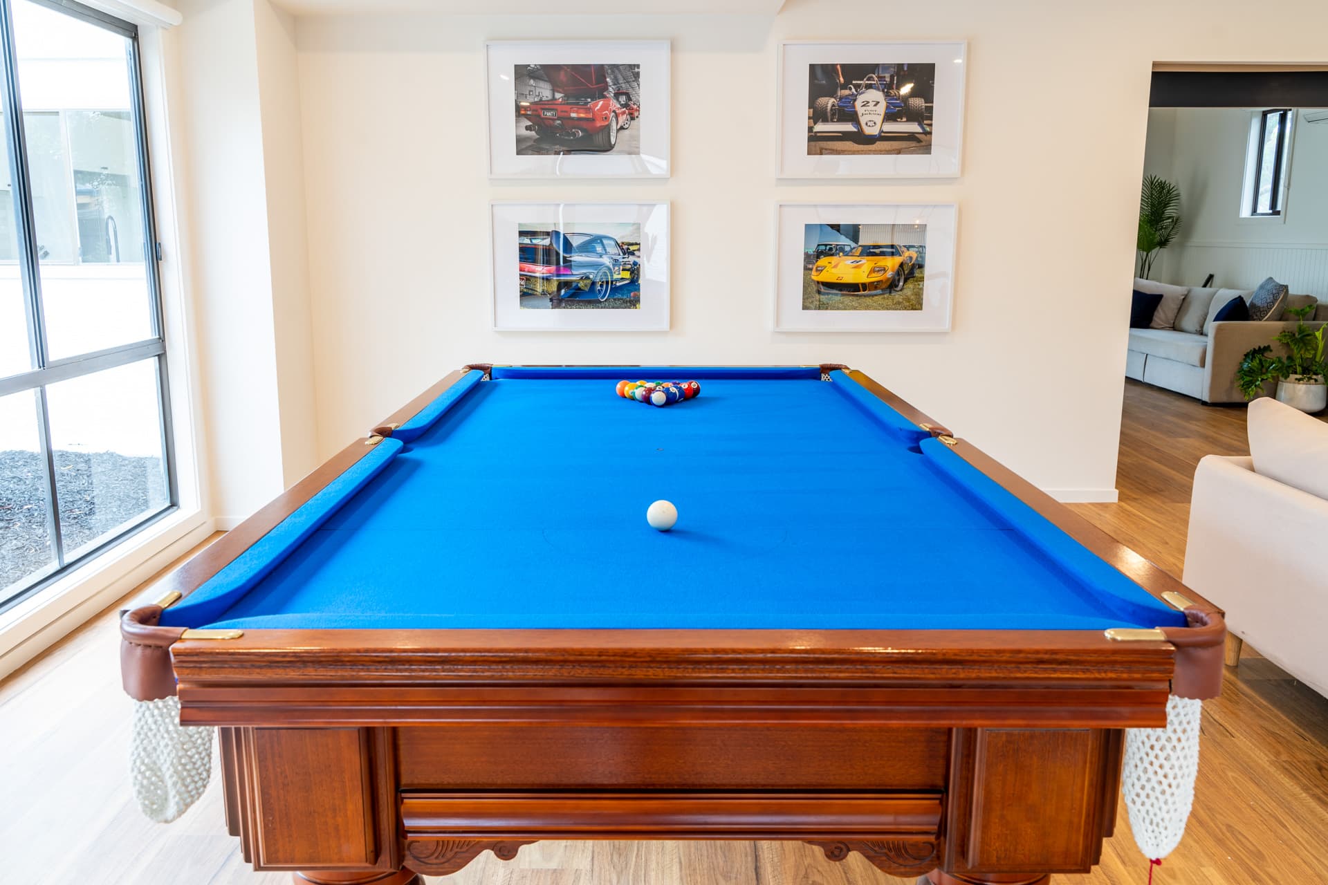 Slate pool table with racing car prints at Big Isle Retreat